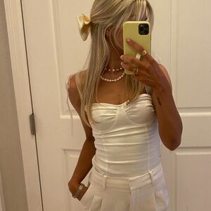 White corset top with ribbon straps,size small. Worn once originally $120